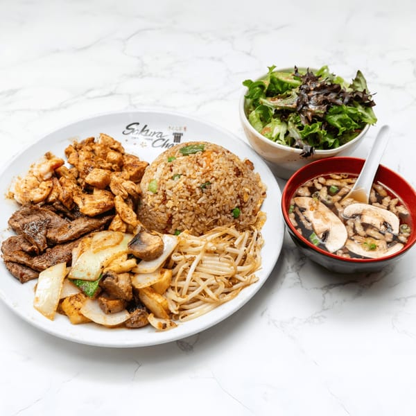 Sakura Chaya hibachi plate with steak, chicken, shrimp, fried rice, vegetables, soup, and salad.