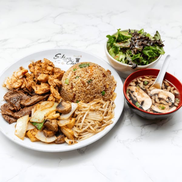 Sakura Chaya hibachi plate with steak, chicken, shrimp, fried rice, vegetables, soup, and salad.
